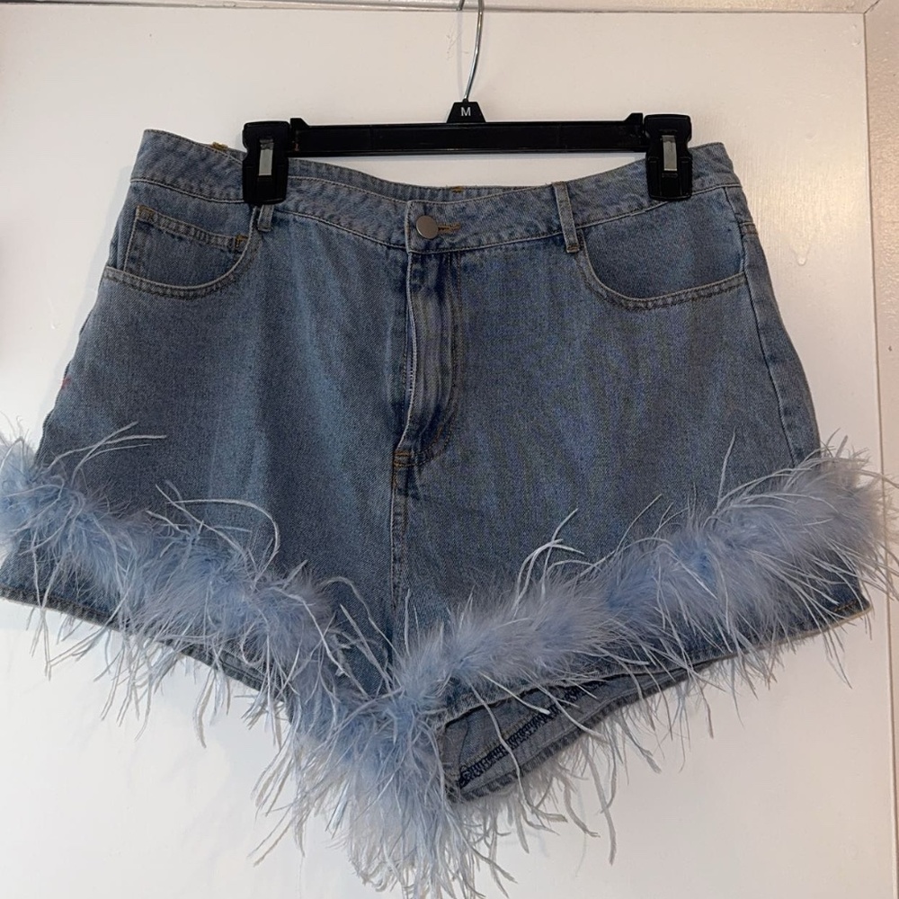 denim shorts with feather/fur trim